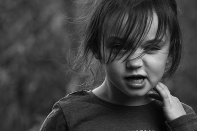 Close-up portrait of cute girl making face