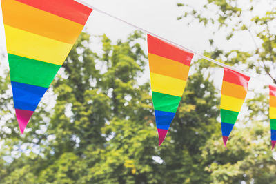 Low angle view of multi colored flags