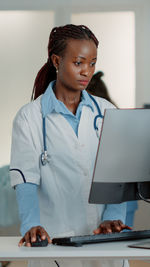 Female doctor working at clinic