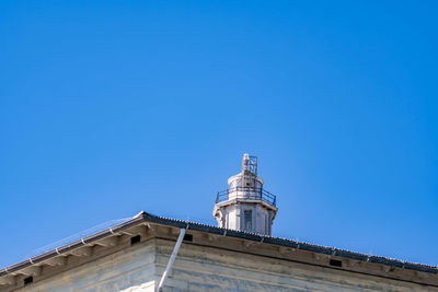 Low angle view of building against clear blue sky