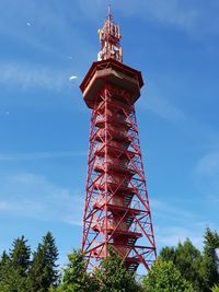 Low angle view of tower against cloudy sky