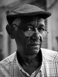 Portrait of old man wearing hat