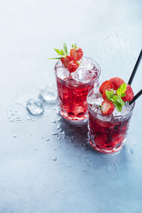 Close-up of red berries on glass