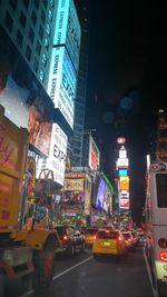 Illuminated city street at night