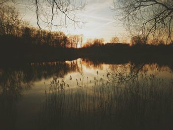 Scenic view of lake at sunset