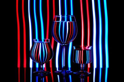 Illuminated lights seen through wineglass