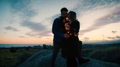 Lovely couple outdoor at sunset