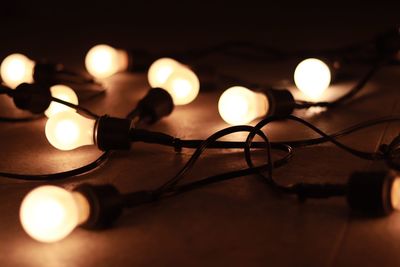 Close-up of illuminated string light on table