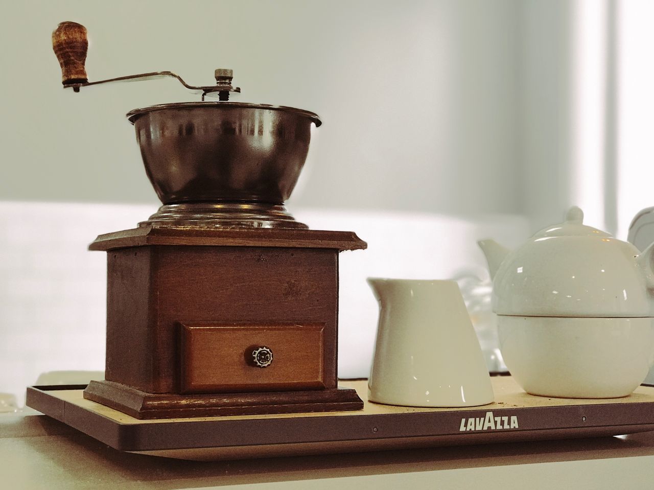 no people, indoors, table, antique, metal, close-up, old, wood - material, retro styled, still life, focus on foreground, container, kettle, weight scale, vintage, appliance, architecture, coffee pot, wall - building feature