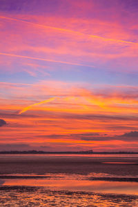 Scenic view of dramatic sky over sea