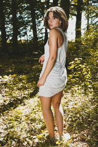 Portrait of young woman in forest