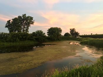 Scenic view of lake against sky during sunset