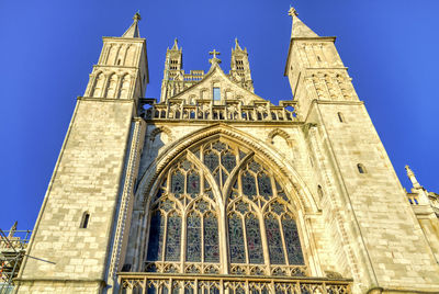 Low angle view of historical building against blue sky