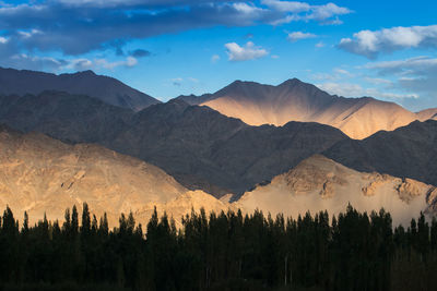 Scenic view of mountains against sky during sunset