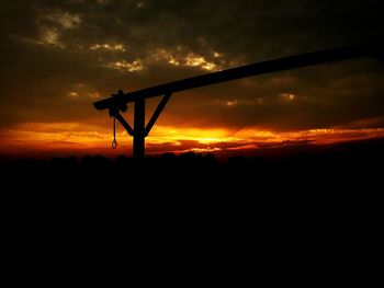 Silhouette landscape against sky during sunset