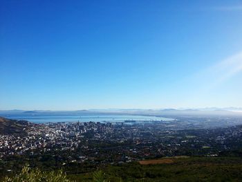 Scenic view of landscape against blue sky