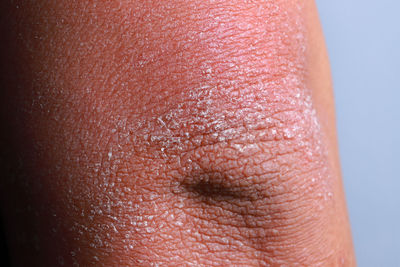 Close-up of person against red background