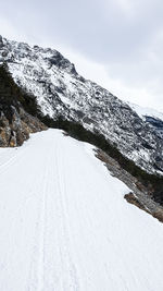 Snow covered mountain against sky