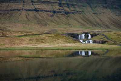 Kirkjufellfoss waterfall near the mountain of kirkjufell in iceland
