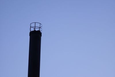 A district heating chimney against the backdrop of a blue sky