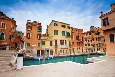 View of buildings against cloudy sky