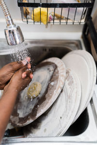 Woman washing her pottery at the ceramics studio