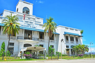 Built structure by building against blue sky