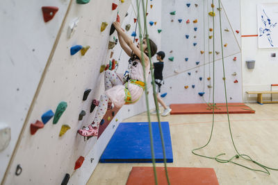 Girl on climbing wall