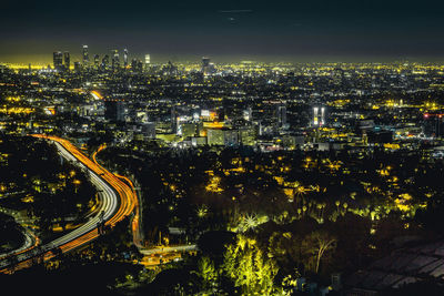 High angle view of illuminated cityscape at night