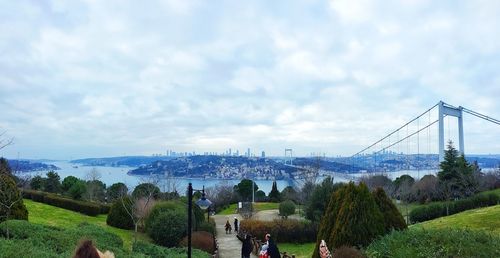 Panoramic view of suspension bridge against sky