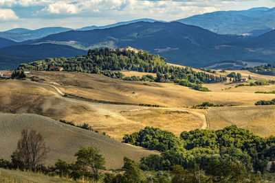 Scenic view of landscape and mountains against sky