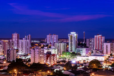 Illuminated buildings in city at night