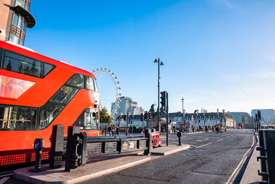 Big ben, westminster bridge and red double decker bus in london, england