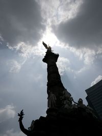 Low angle view of statue against sky