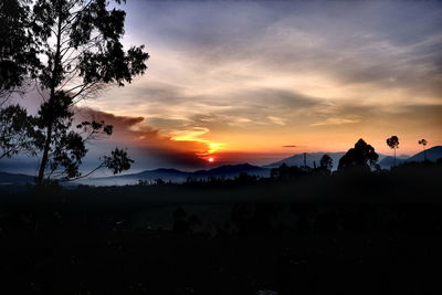 Scenic view of silhouette landscape against sky during sunset