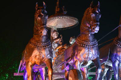 Close-up of illuminated statue