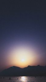 Scenic view of sea against clear sky during sunset