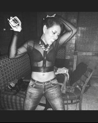 Close-up of young woman sitting on bench