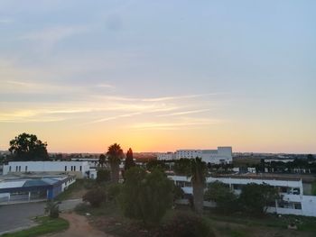 High angle view of buildings against sky during sunset