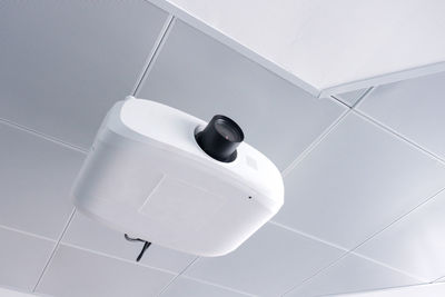 Low angle view of projector against ceiling