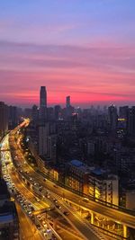 Illuminated cityscape at sunset