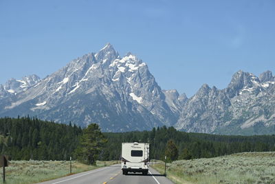 Scenic view of snowcapped mountains against clear sky