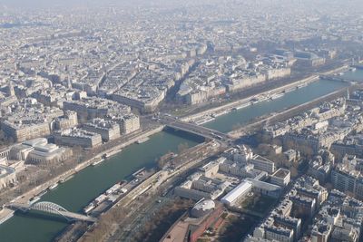 High angle view of river amidst buildings in city