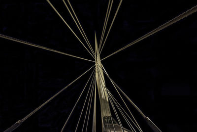 Low angle view of illuminated bridge against sky at night