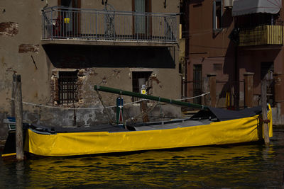 Boats moored in canal