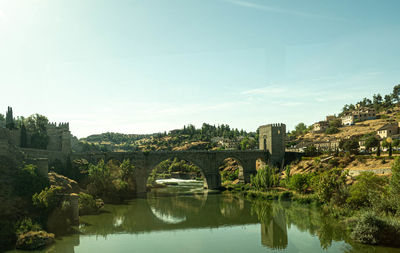 Bridge over river against sky