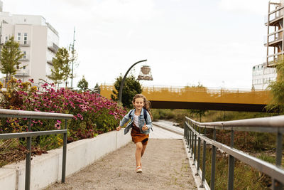 Girl running towards camera