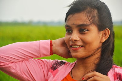 Portrait of happy girl on field
