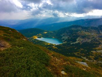 Scenic view of lake amidst mountains