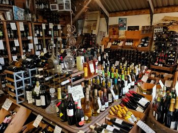 Panoramic shot of bottles on display